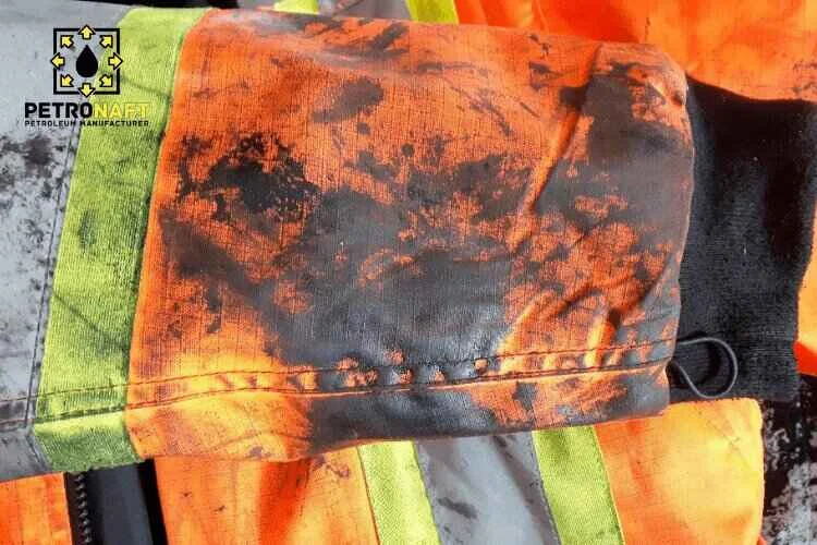 Road construction worker's clothes that are dirty with bitumen and now should remove bitumen from clothes