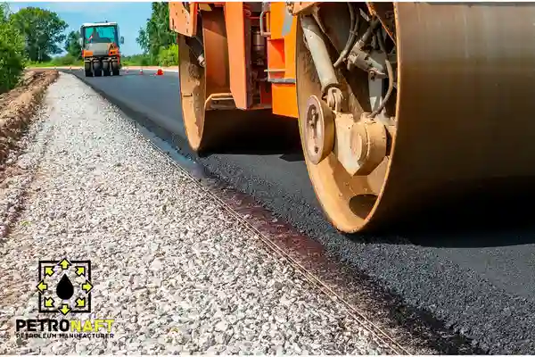Roller compacting asphalt layers and road construction