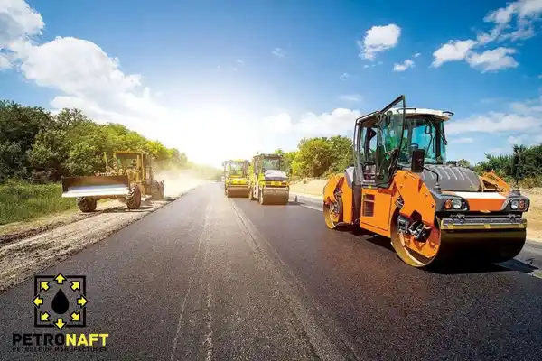 A road being built using Gilsonite mixed in asphalt.