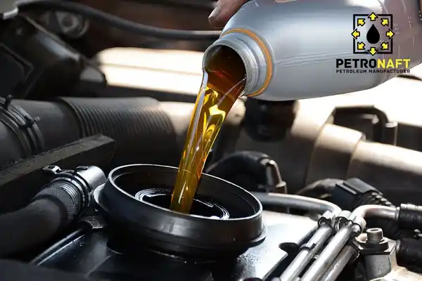 Pouring engine oil into the car engine, oil made from base oil