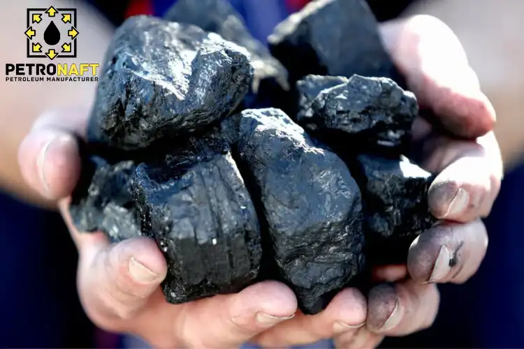 Pieces of gilsonite in the hands of a worker, a view of the value and gilsonite price