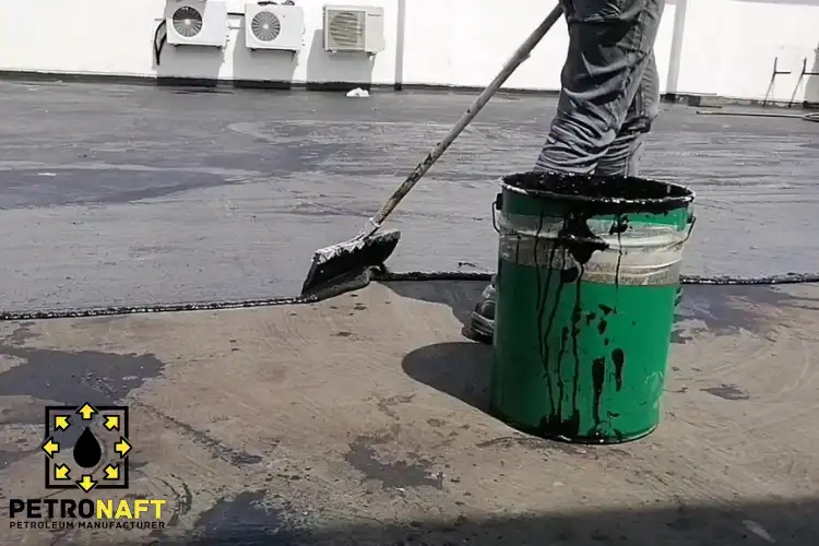 Worker Using Polymer Modified Bitumen for Waterproofing