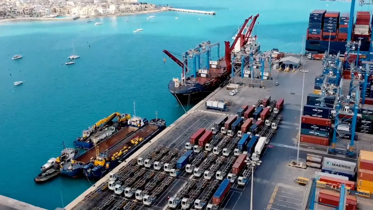 PETRONAFT 7 Container port with ships, cranes, and trucks handling cargo for industrial shipping logistics