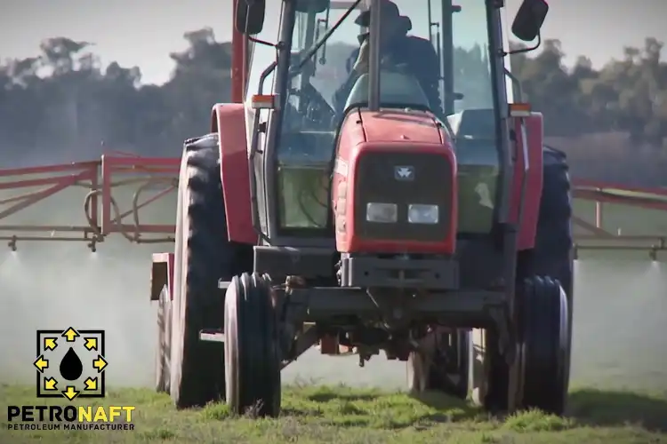 Tractor spreading Caustic Soda for Agriculture on a farm