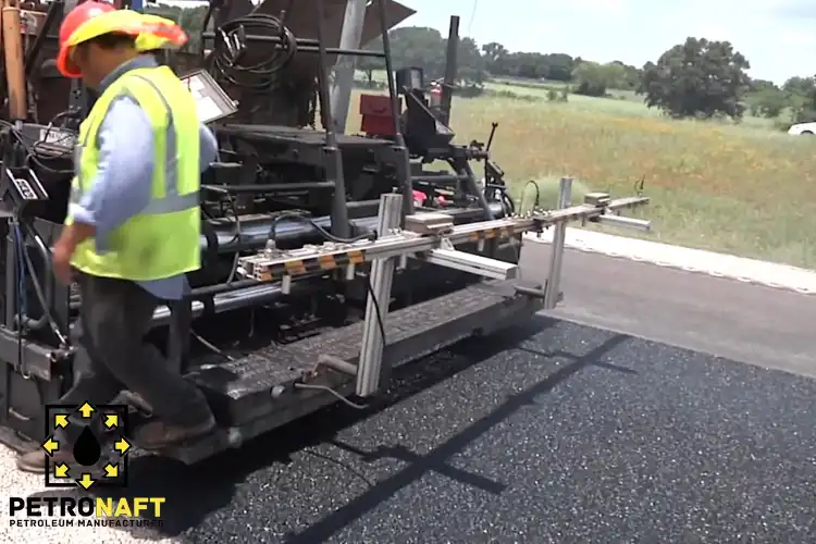Machine laying asphalt using Performance Grade Bitumen for Asphalt