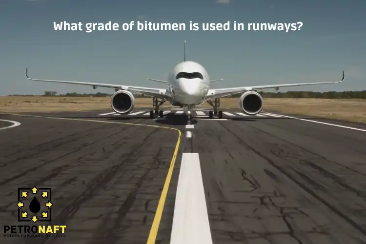 An airport runway built with bitumen and an airplane ready to fly