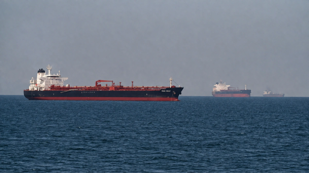 PETRONAFT 2 Oil tanker navigating a narrow shipping channel near an arid coastline, reflecting disrupted maritime traffic through the Strait of Hormuz